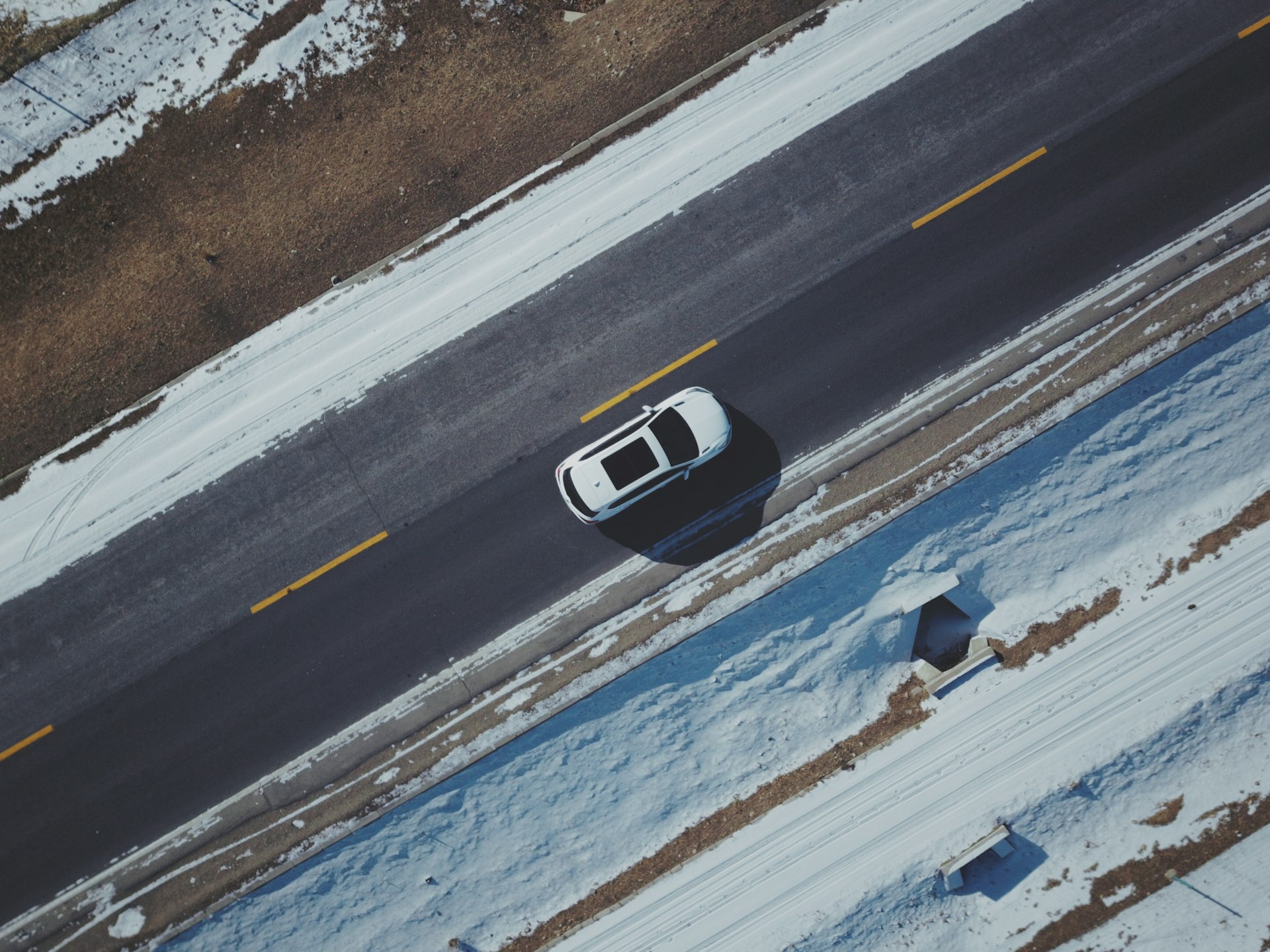 white and black car on road during daytime